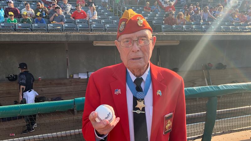 The medal of honor recipient poses before throwing out the ceremonious first pitch at the West...