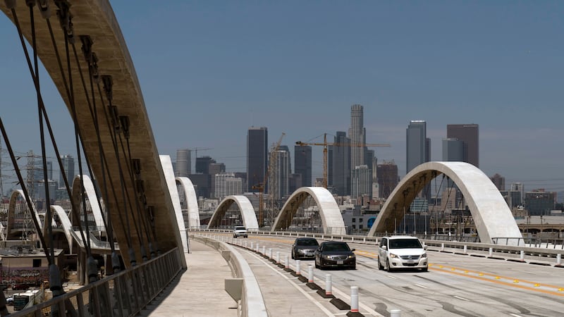 FILE - Cars move along the 6th Street Viaduct in Los Angeles, Wednesday, July 27, 2022. Police...